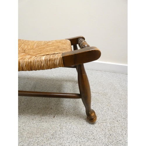 369 - Arts & Crafts style stained beech stool with woven rush top.  Height 28cm, Width 63cm.