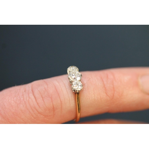 110 - 18ct gold and three stone diamond trilogy ring, the brilliant round cut diamonds on platinum setting... 