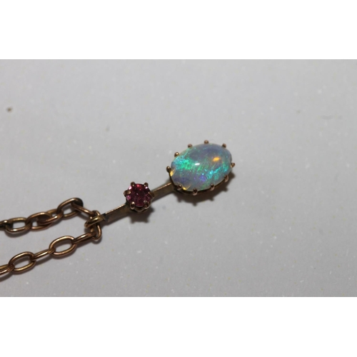 164 - 9ct gold opal and ruby pendant necklace having a fringe of eleven graduated suspended stones, 5.8g g... 