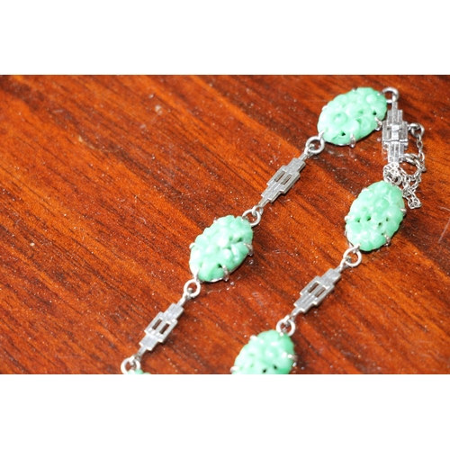 170 - Chinese 9ct white gold and carved and pierced jade bracelet, 8.9g gross and a similar dress ring, si... 