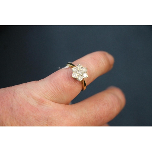 87 - 18ct yellow gold and diamond cluster ring, the seven round brilliant cut stones measuring approx. 1.... 