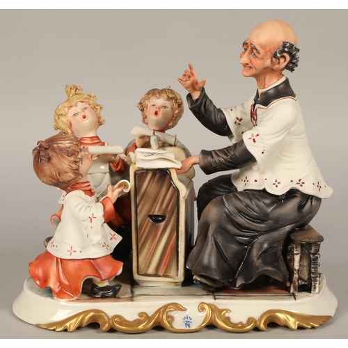 214 - Capodimonte figure group depicting a choir master and five choristers (6)