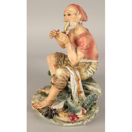 217 - Italian Capodimonte figure of a fisherman smoking a pipe with his catch marked N to base,