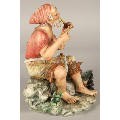 217 - Italian Capodimonte figure of a fisherman smoking a pipe with his catch marked N to base,