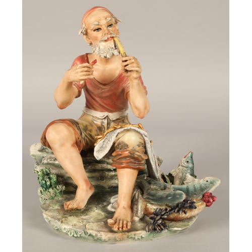 217 - Italian Capodimonte figure of a fisherman smoking a pipe with his catch marked N to base,