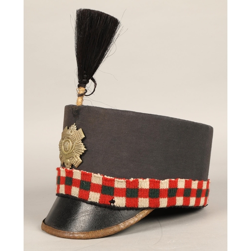 243 - Highland Light Infantry shako cap with badge and feather hackle, in carrying tin