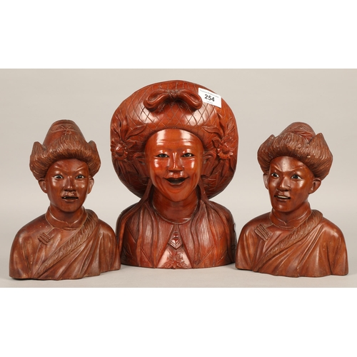 254 - Three oriental bust carvings