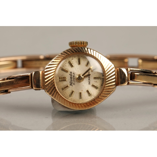 119 - Nivada 9ct gold wristwatch with case