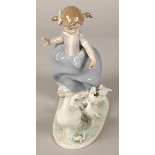 221 - Lladro figure of a girl with geese. 20cm