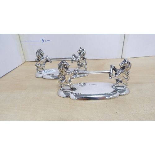 22 - Pair of EPNS horse knife rests and a two-piece EPNS tea set.