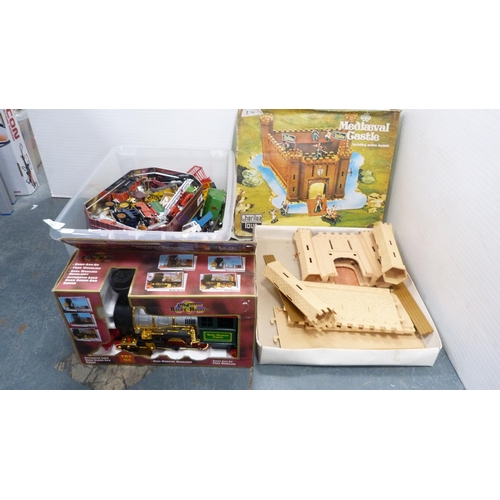 32 - Plastic box containing playworn and other vehicles, Rocky Mountain battery-operated locomotive and a... 