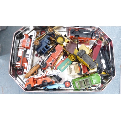 32 - Plastic box containing playworn and other vehicles, Rocky Mountain battery-operated locomotive and a... 