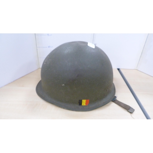 9 - Two military caps, helmet, shovel and a cased gas mask.