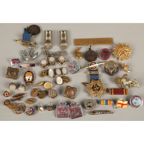 161 - Assorted pin badges including military, Rotary, etc