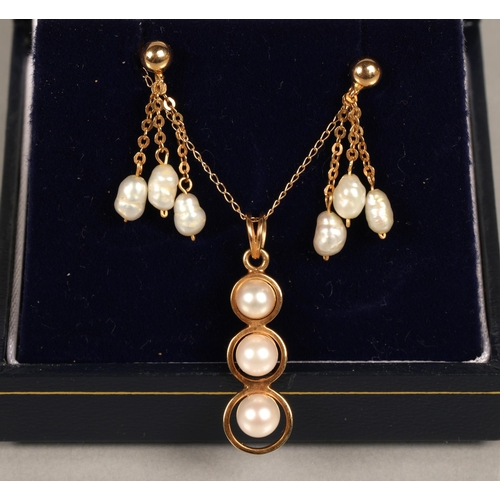 171 - 14K gold pendant necklace set with pearls, and similar yellow metal earrings