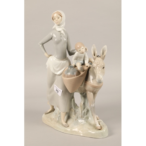 242 - Large Lladro figure of a mother and child with donkey