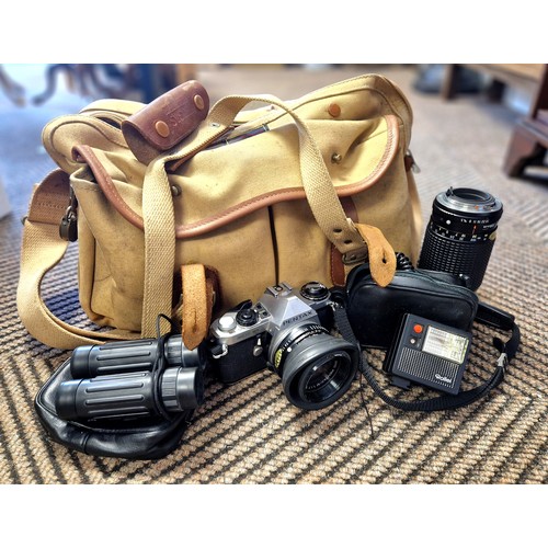 328 - Pentax SLR camera and lenses, other accessories and a pair of binoculars