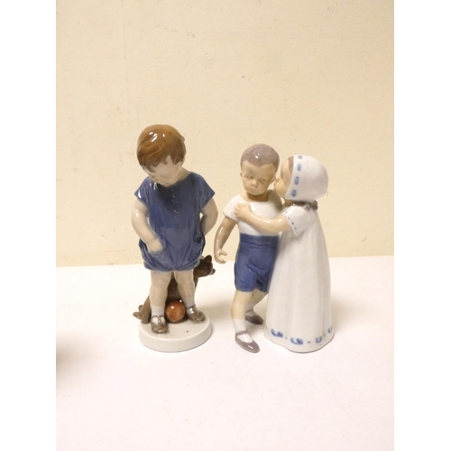 208 - Three Royal Copenhagen figures to include boy with dog, shape number 782, boy holding a teddy bear, ... 