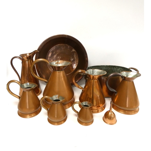 240 - Group of copper kitchenalia to include large bowl and a set of graduated measuring jugs, along with ... 