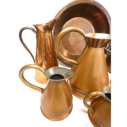 240 - Group of copper kitchenalia to include large bowl and a set of graduated measuring jugs, along with ... 