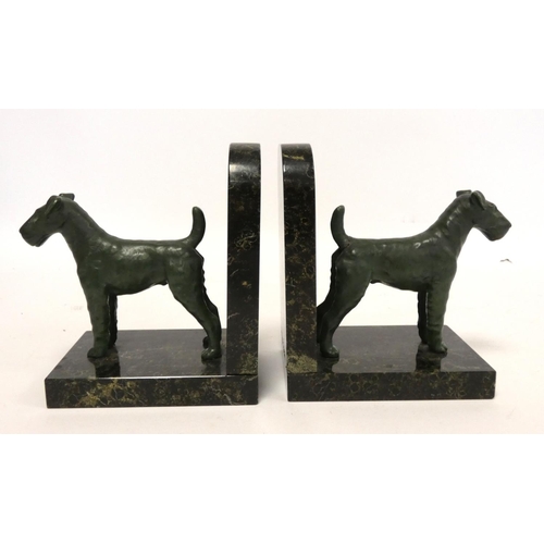 242 - Pair of cold painted terrier bookends on a mottled marble effect base. 15cm high.