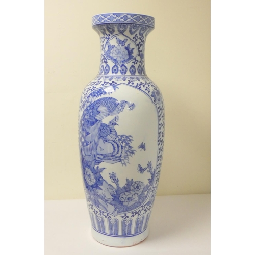 229 - Large oriental porcelain blue and white vase decorated with peacocks, scrolls and foliage, the under... 