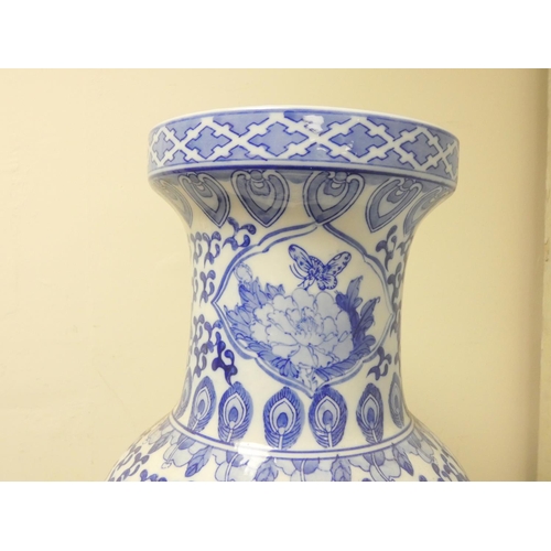 229 - Large oriental porcelain blue and white vase decorated with peacocks, scrolls and foliage, the under... 