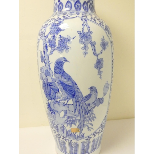 229 - Large oriental porcelain blue and white vase decorated with peacocks, scrolls and foliage, the under... 