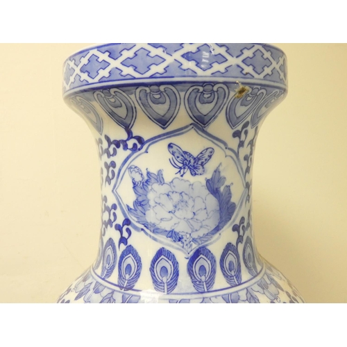 229 - Large oriental porcelain blue and white vase decorated with peacocks, scrolls and foliage, the under... 