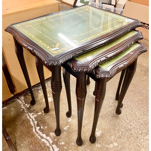 594 - Set of three nesting tables with green leather inserts and glass tops 