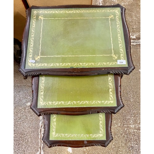 594 - Set of three nesting tables with green leather inserts and glass tops 