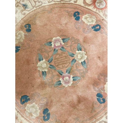 606 - Pink ground circular Chinese rug