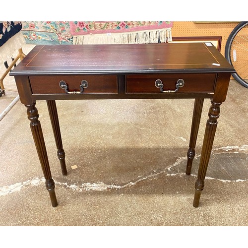 610 - Mahogany side table fitted two frieze drawers.