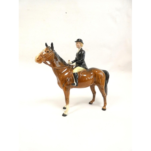 212 - Beswick Huntswoman porcelain figure on brown horse, model no.1730. Height 21cm