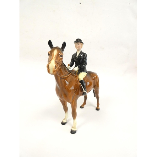 212 - Beswick Huntswoman porcelain figure on brown horse, model no.1730. Height 21cm