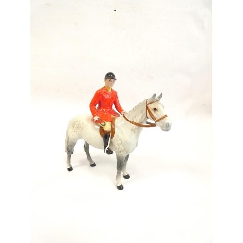 213 - Beswick Huntsman porcelain figure of a Huntsman on a mottled grey horse, model no.1501. Height 21cm