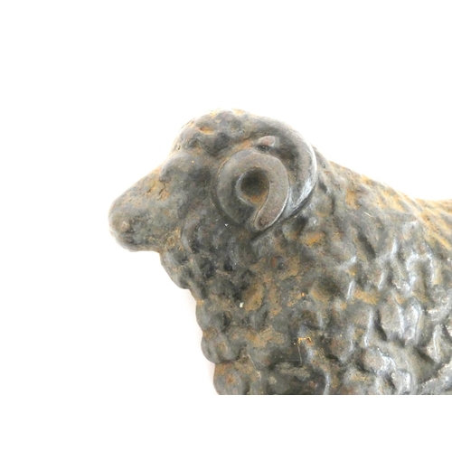 245 - Victorian cast iron doorstop in the form of a ram. Height 19cm 