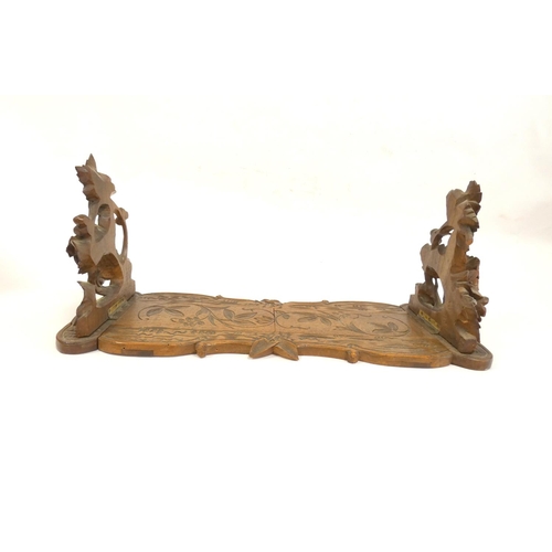 339 - Antique Black Forest carved extending book slide with carved leaf and flower reliefs. Height 16cm. W... 