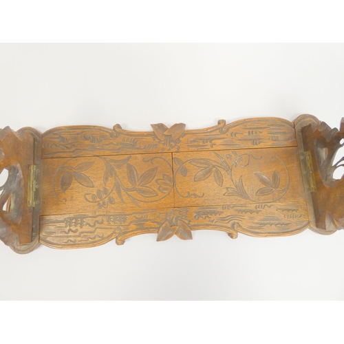 339 - Antique Black Forest carved extending book slide with carved leaf and flower reliefs. Height 16cm. W... 