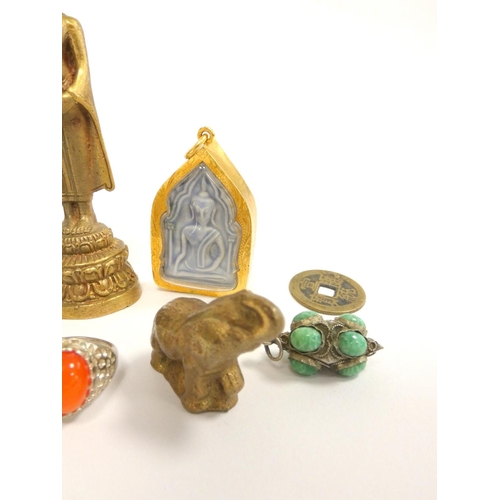 80 - Oriental jewellery to include a carved nephrite ring, Thai standing Buddha figure, silver Tibetan ca... 