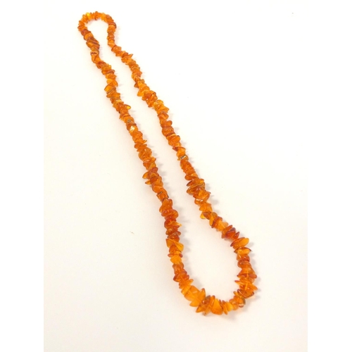 82 - Two strung raw amber necklaces. Length 29cm & 36cm. (2)