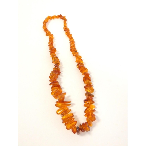 82 - Two strung raw amber necklaces. Length 29cm & 36cm. (2)