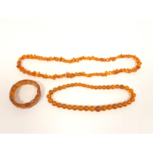 83 - Amber jewellery to include a strung raw amber necklace, length 32cm, amber bead necklace, length 44c... 