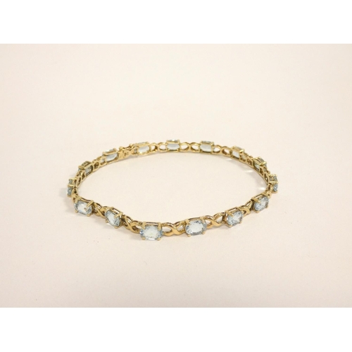 84 - 9ct gold and aquamarine tennis bracelet, length 21cm, 9g.