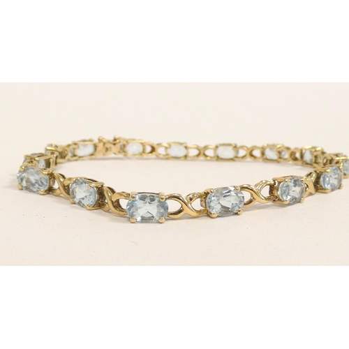 84 - 9ct gold and aquamarine tennis bracelet, length 21cm, 9g.