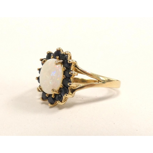 85 - 9ct gold opal and sapphire cluster ring, Size L 2.3g 