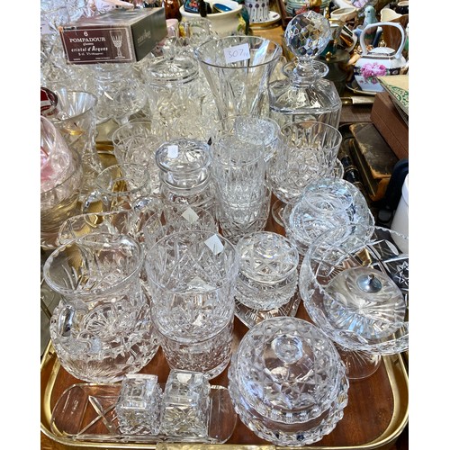 307 - Large quantity of cut glass crystal to include decanter, vases, ashtrays, jugs, sugar bowls, two tra... 