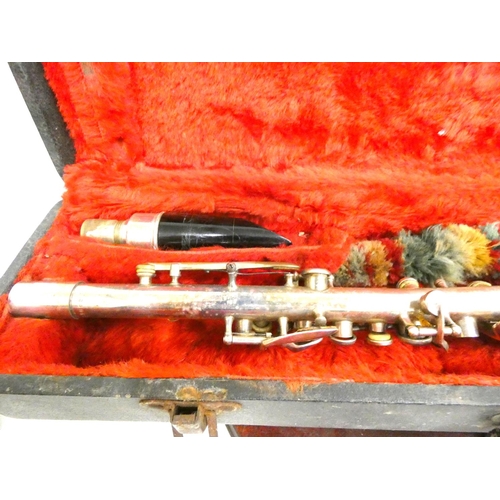 69 - Antique silver plated USA made, clarinet in case.