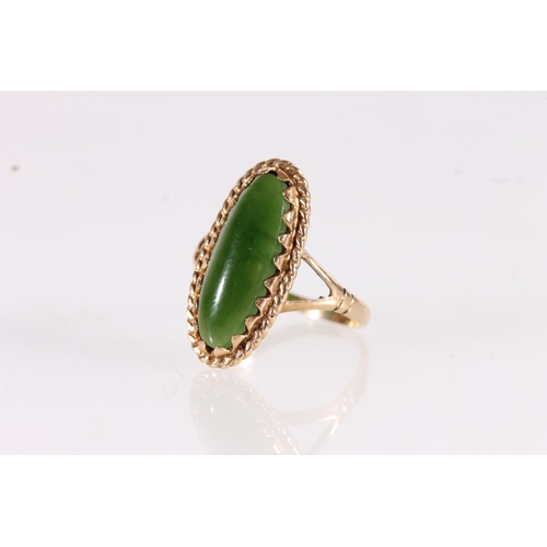 504 - 9ct gold dress ring set with a large New Zealand pounamu jade green cabochon stone of navette shape,... 