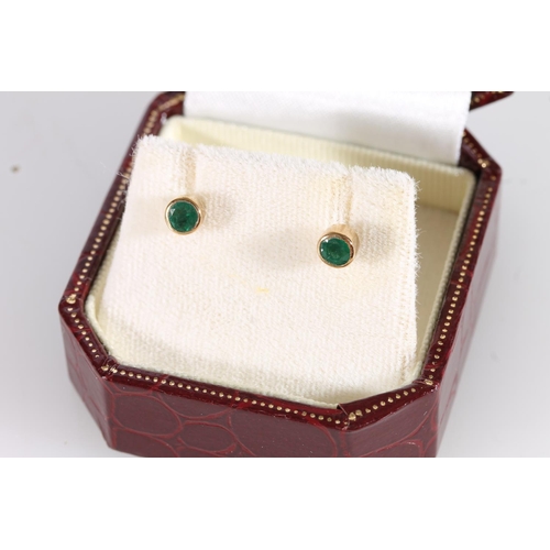 508 - Pair of gold mounted ear studs set with faceted emerald green stones, 0.8g gross, in Alistair Wood T... 